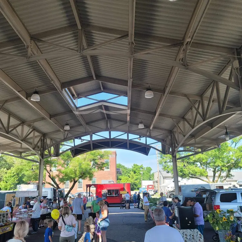 Under the pavilion at a Saturday market.