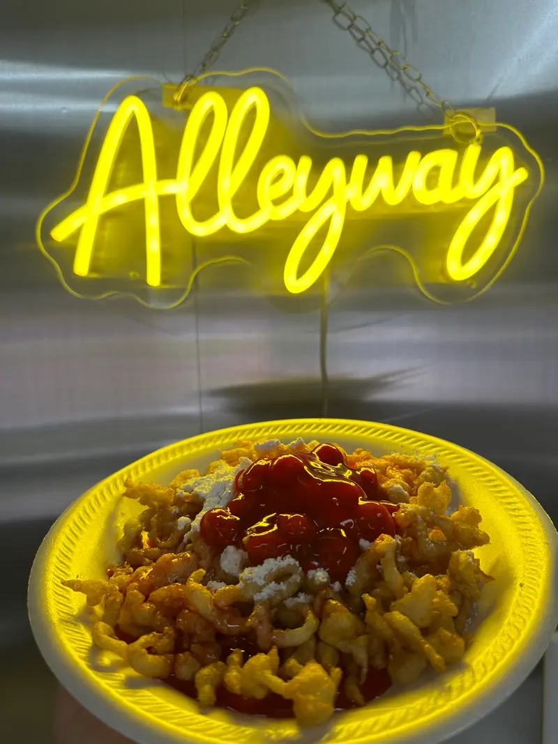 The neon sign, and smash fries.