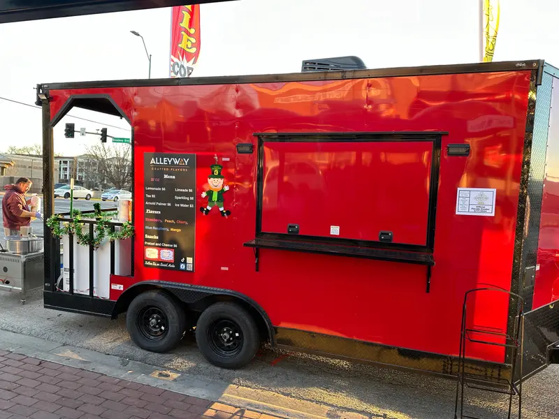 The red trailer, doors up.