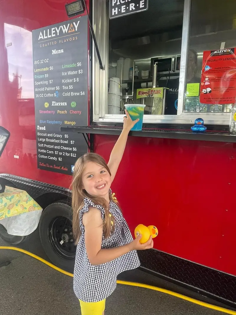 A young customer at the trailer's pick-up window.